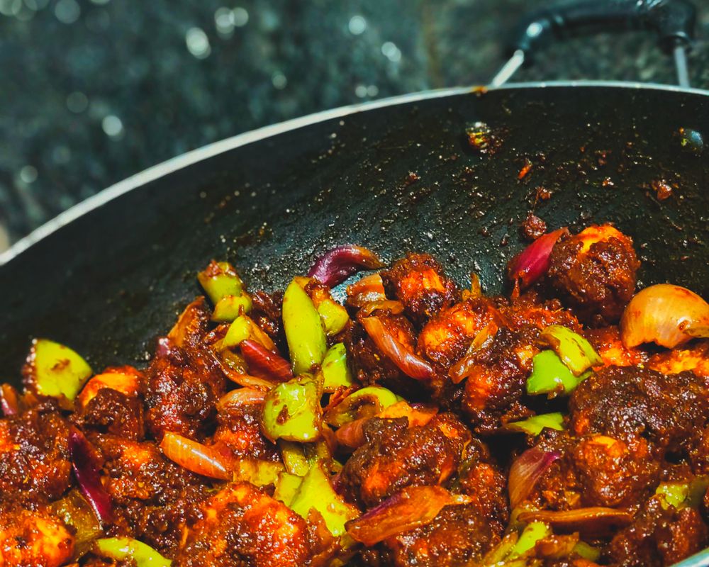 Spicy chilli prawns cooked in an Indian wok